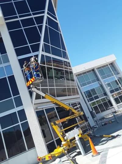 High Rise Cleaners at boom lift glass building